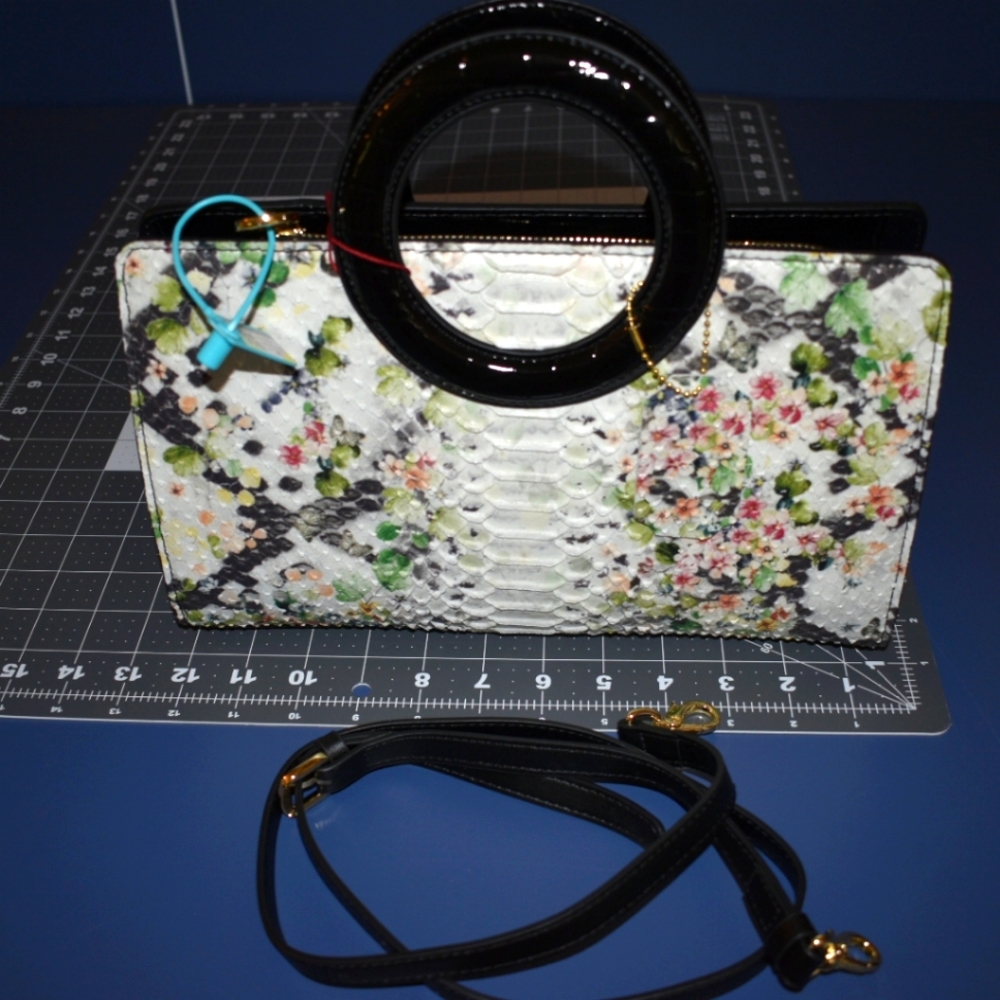 Black flower textured handbag